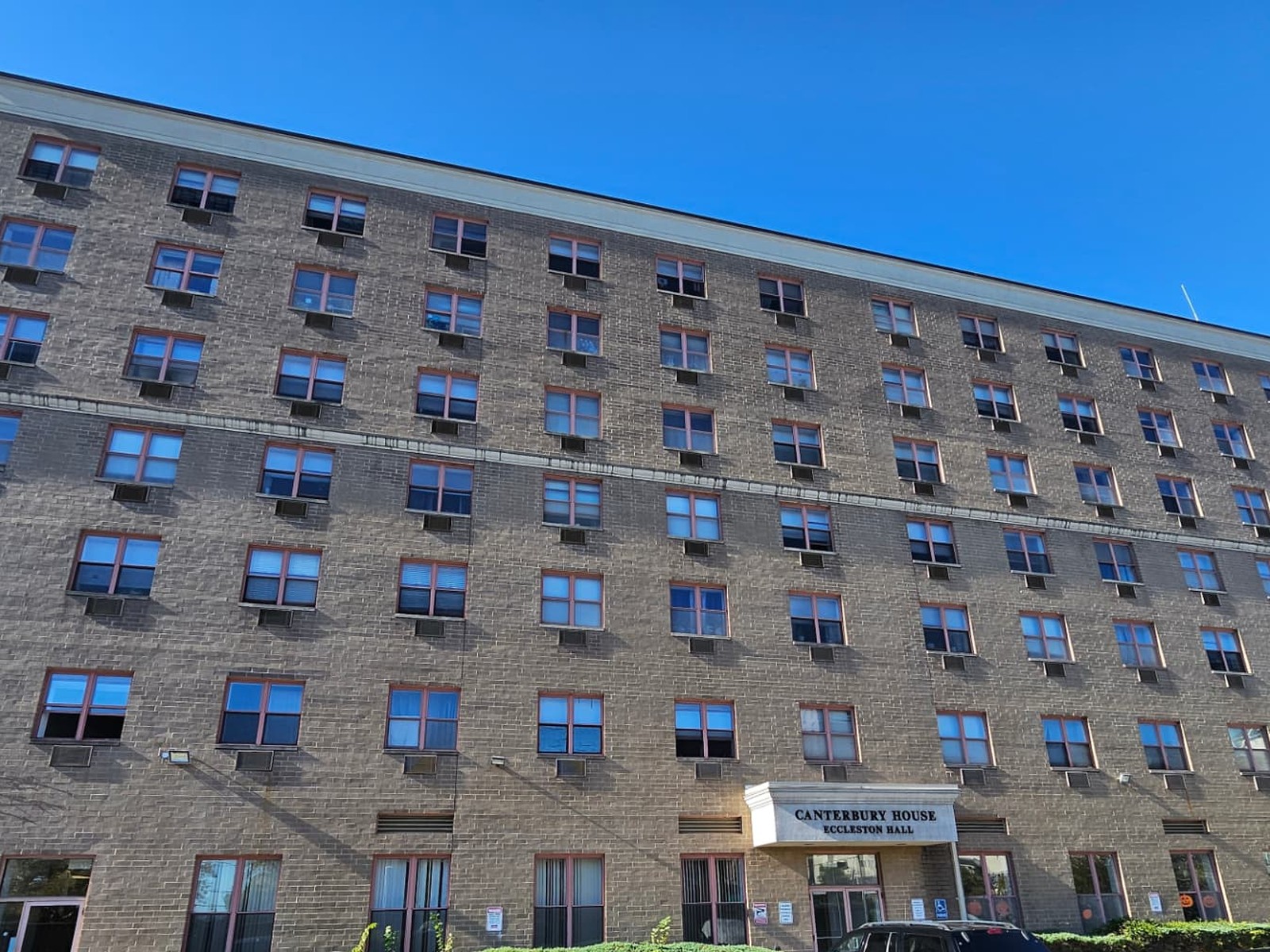 Canterbury House, a six-story brick residential building on Staten Island, New York, seen from its parking lot